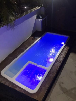 Linda casa com piscina de frente para Praia Grande em Arraial do Cabo-Rj